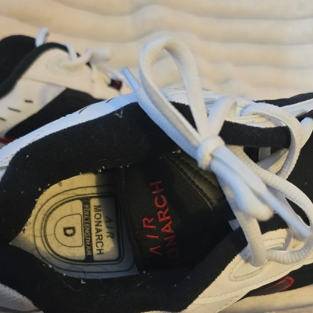 Nike Men's Black and White Sneakers with Red Details